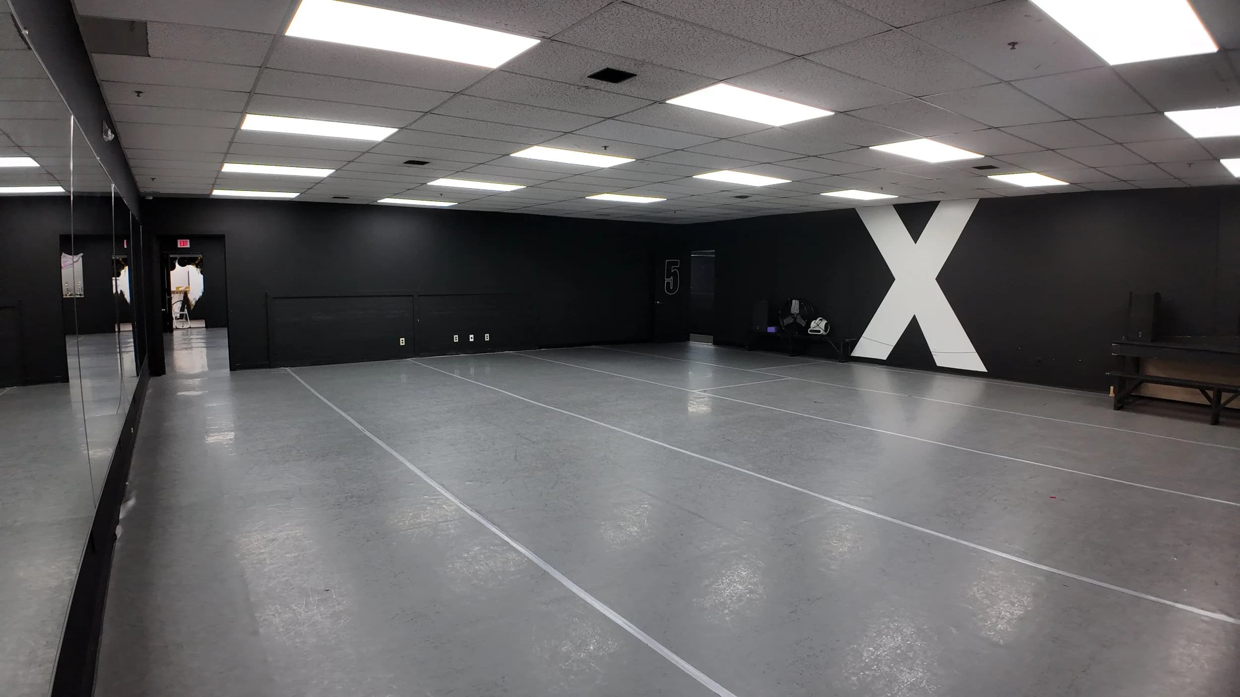 DXNY dance studio with illuminated X wall feature