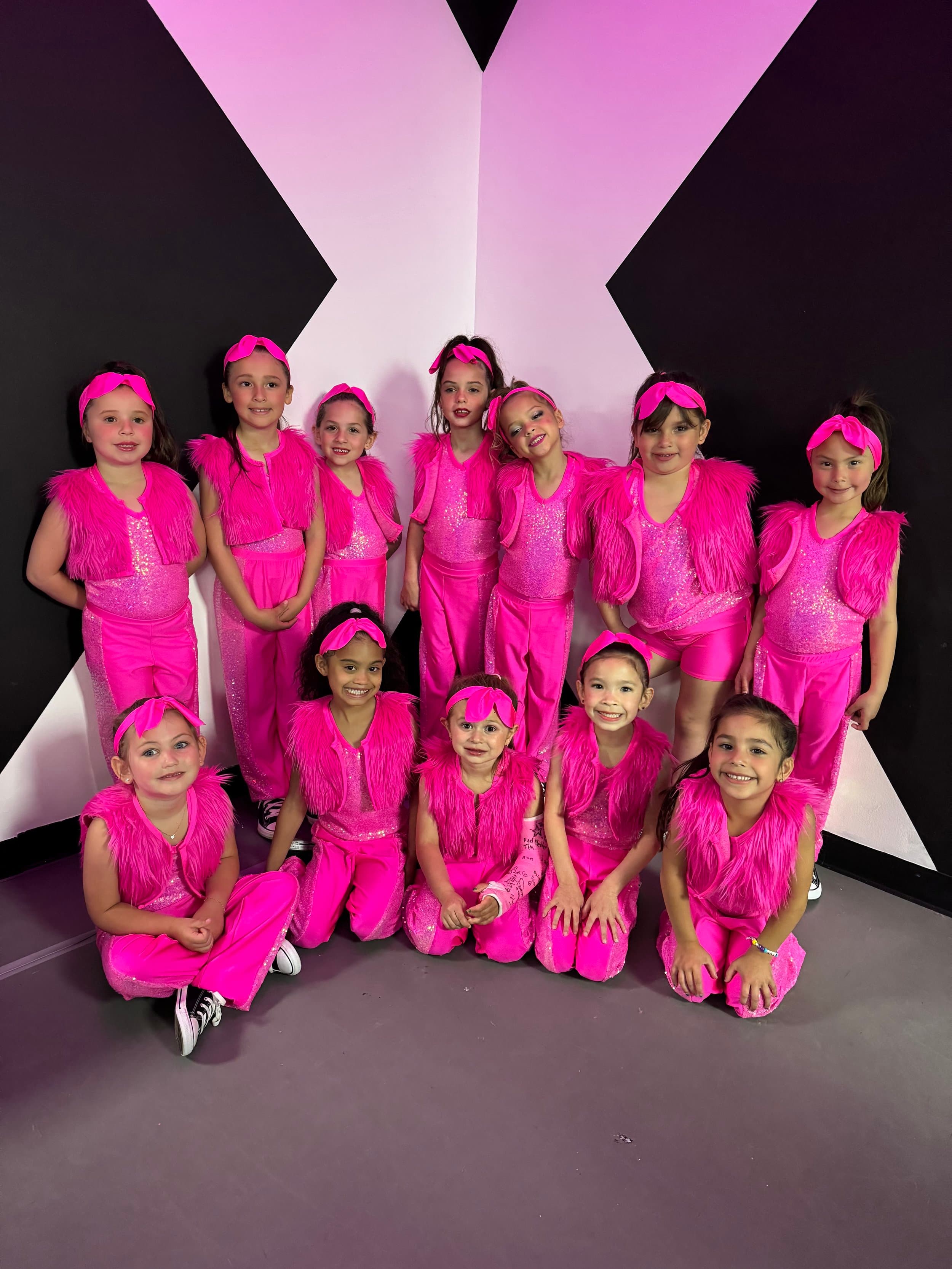 DXNY pre-comp team in pink costumes